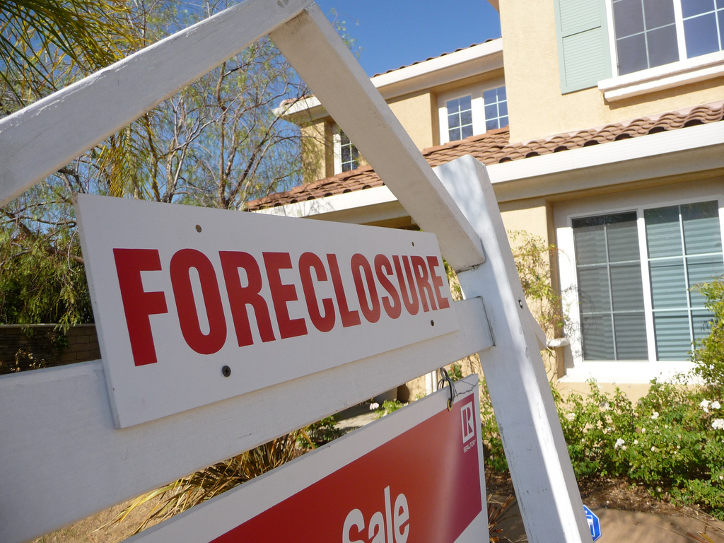 A foreclosure sign in front of a home. (Credit: Jeff Turner/Flickr)
