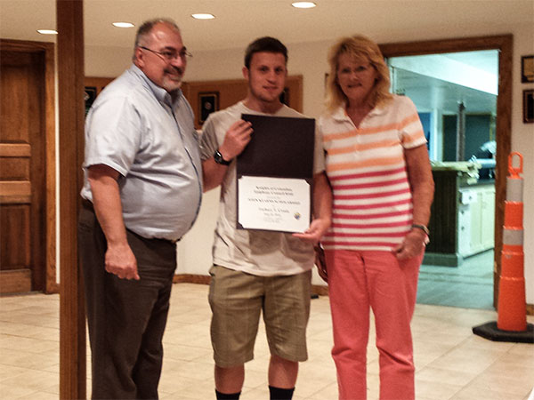Zachary Crosio received a scholarship award from Grand Knight John Castle and Barbara Kearns. (Photo: Patricia Nee)
