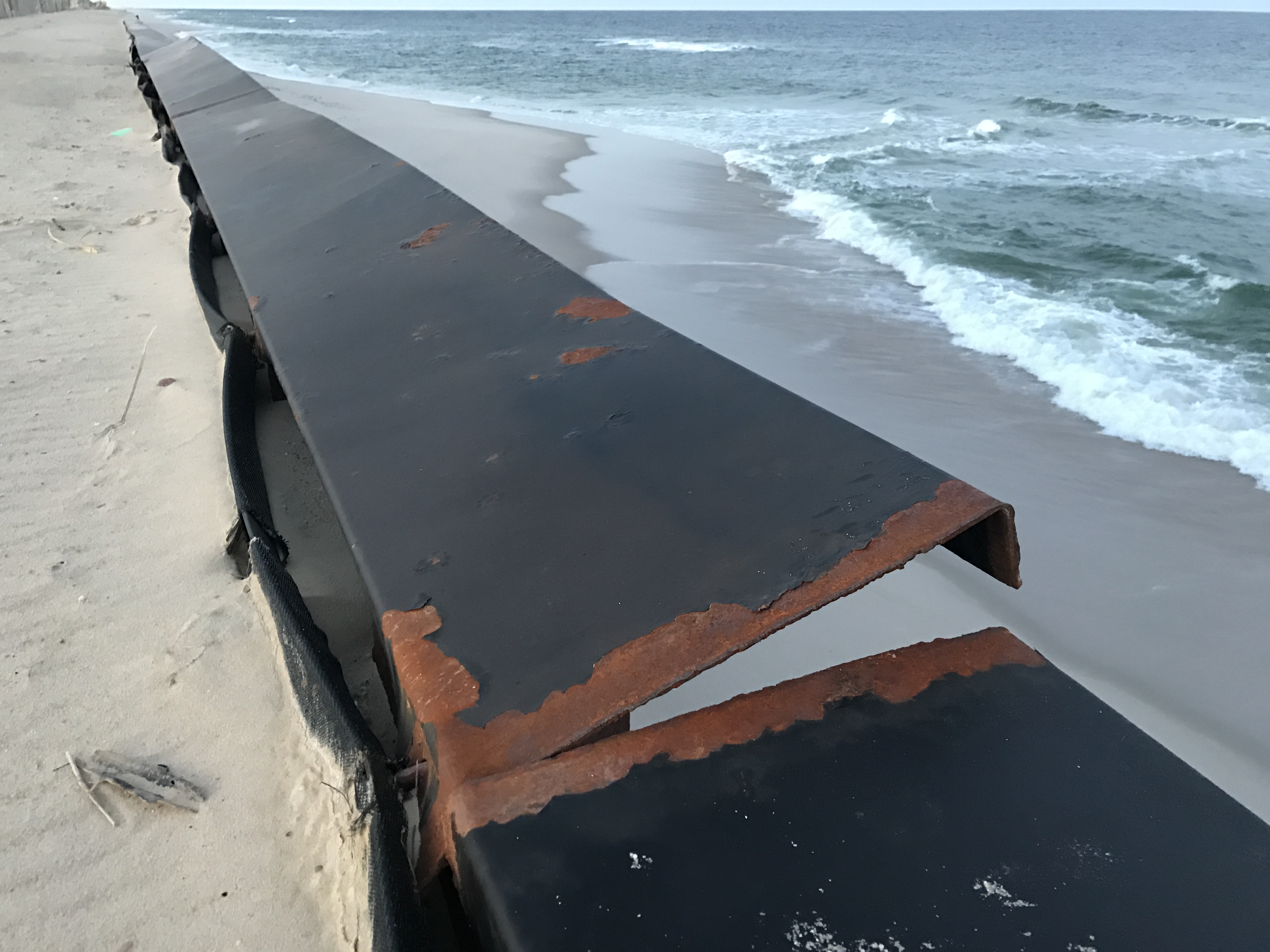 A bulkhead cap on Brick's sea wall is dislodged, March 2017. (Photo: Daniel Nee)