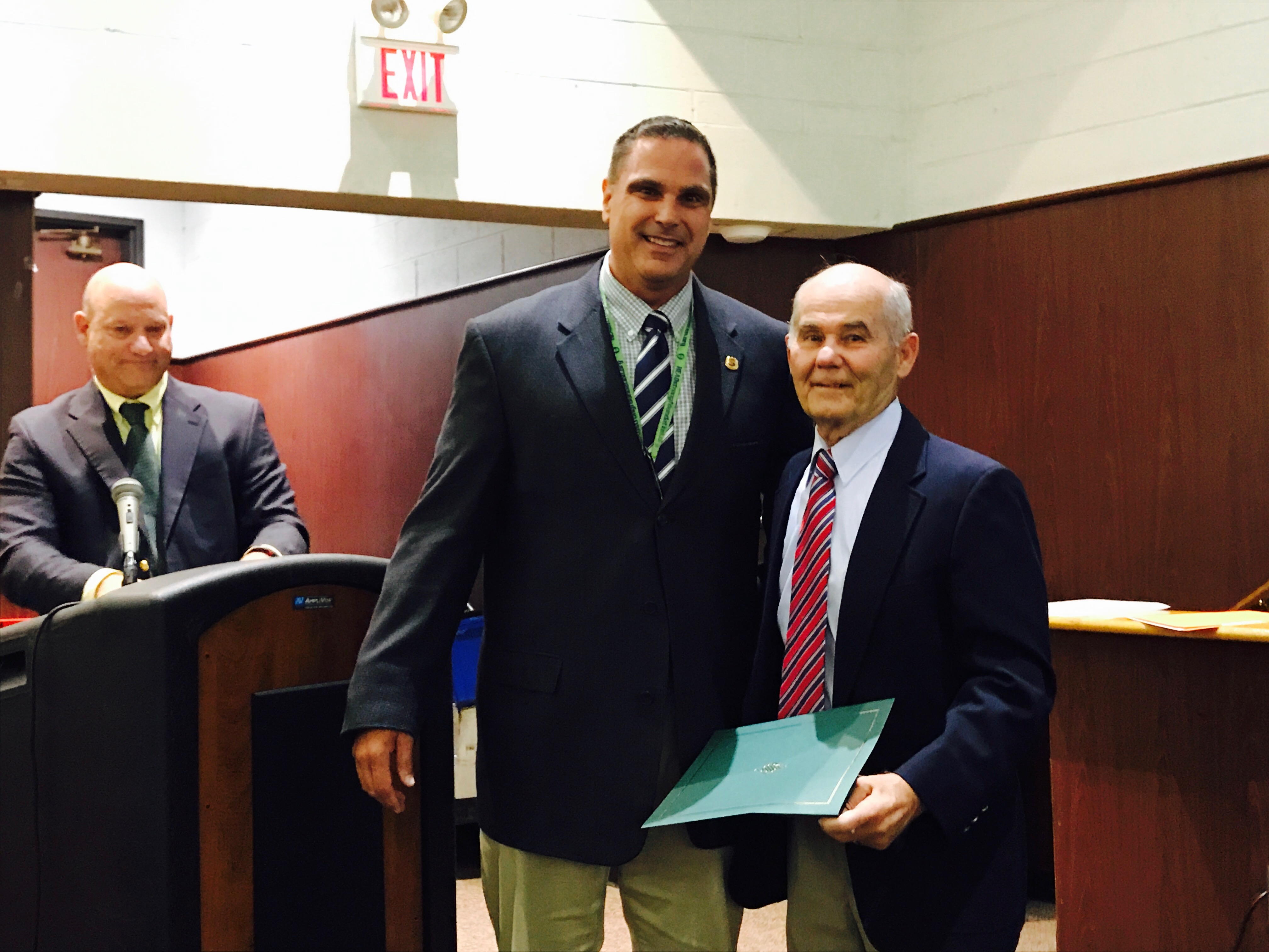 Coach Bob Auriemma (right) with Board President John Lamela and Interim Superintendent Dennis Filippone. (Photo: Daniel Nee)