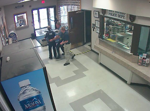 Brick police officers save the life of an EMT at town hall. (Photo: Brick Twp. Police)
