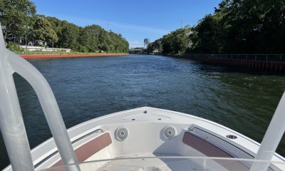 A boat traverses the Point Pleasant Canal, Summer 2021. (Photo: Daniel Nee)