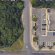 The property at 341 Drum Point Road, Brick, N.J. (wooded lot) where three homes are proposed. (Credit: Google Maps)