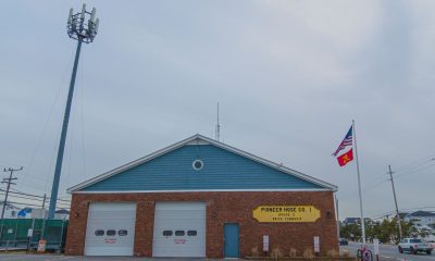 The Pioneer Hose fire company's station on Route 35 in Brick, flanked by a communications tower. (Photo: Daniel Nee)