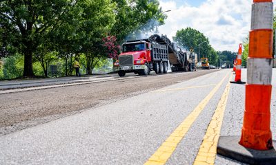 A paving crew works on a residential street. (File Photo: Creative Commons/ Greenville)