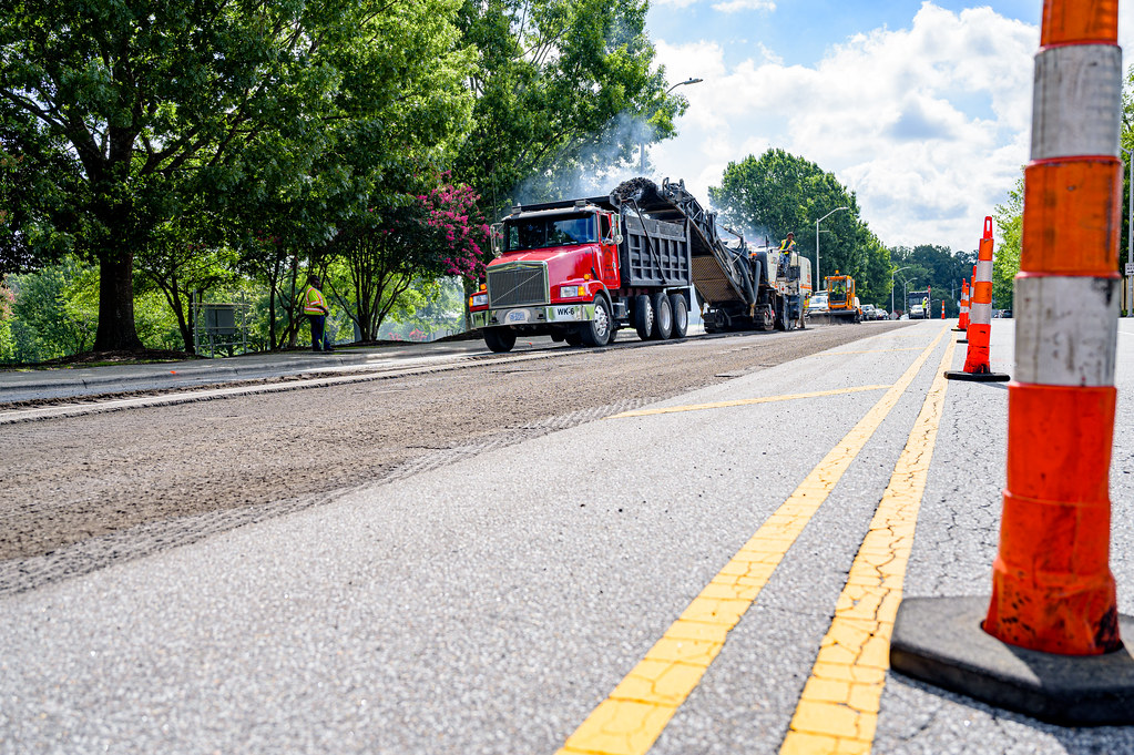 A paving crew works on a residential street. (File Photo: Creative Commons/ Greenville)