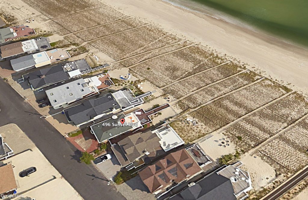 An aerial photo of the marked home, slated for reconstruction, in question. (Google Earth)