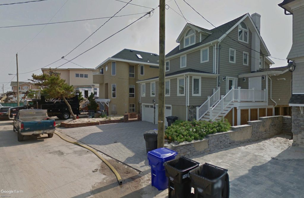 Historic imagery after Superstorm Sandy of the two homes in question. (Google Earth)