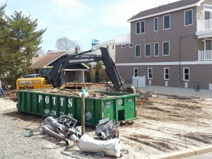 A house demolition being completed. (File Photo)