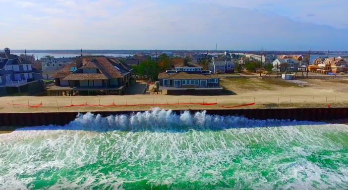 Waves crash against a sea wall in Mantoloking, NJ. (Photo: Mantoloking Aerial Photography)