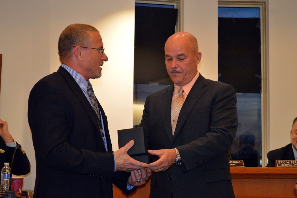 Christopher Parlow receives a retirement gift from Lavallette Mayor Walter LaCicero. (Photo: Daniel Nee)