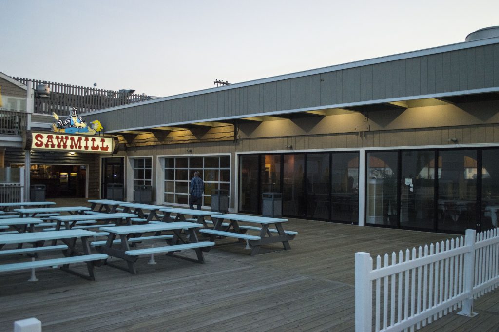 Outdoor seating at the Sawmill, and the remainder of the building that has been converted to a restaurant dining room. (Photo: Daniel Nee)
