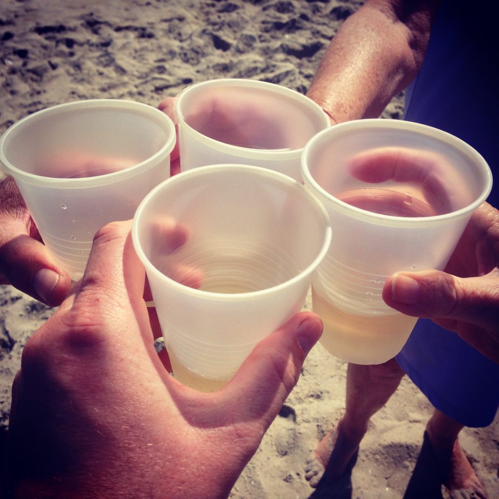 Enjoying a drink on an NJ beach.