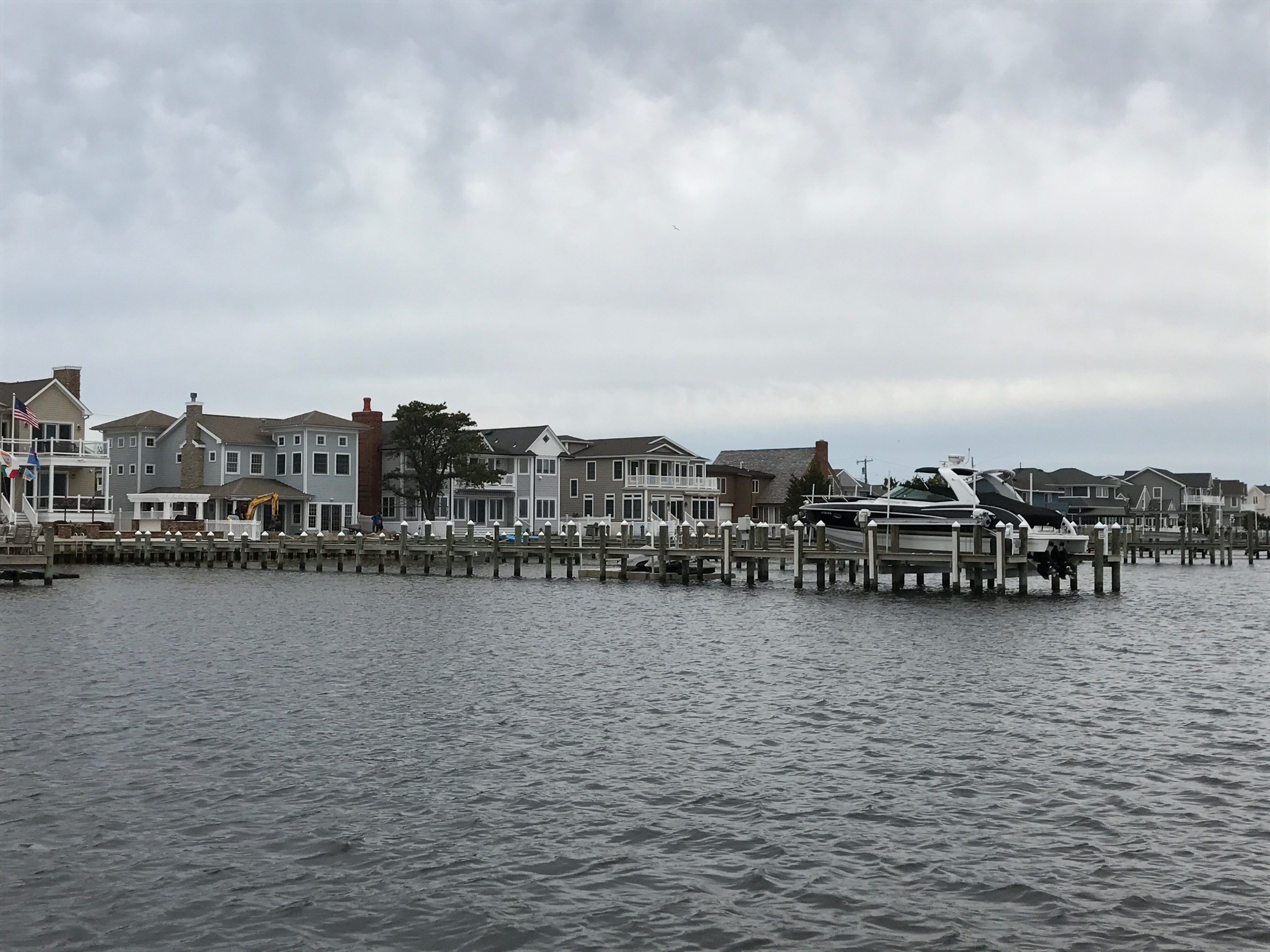 A boat dock extends out into Barnegat Bay. (Photo: Daniel Nee)