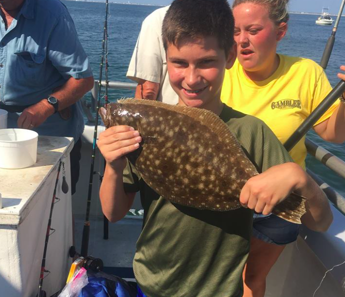 A happy young fluke angler on board the Gambler. (Photo: Gambler Crew)