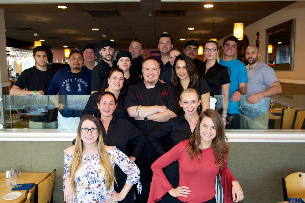 Chef Mike Jurusz, and his staff, in the main dining of room of his restaurant, Chef Mike's ABG. (Photo: Chef Mike's ABG)