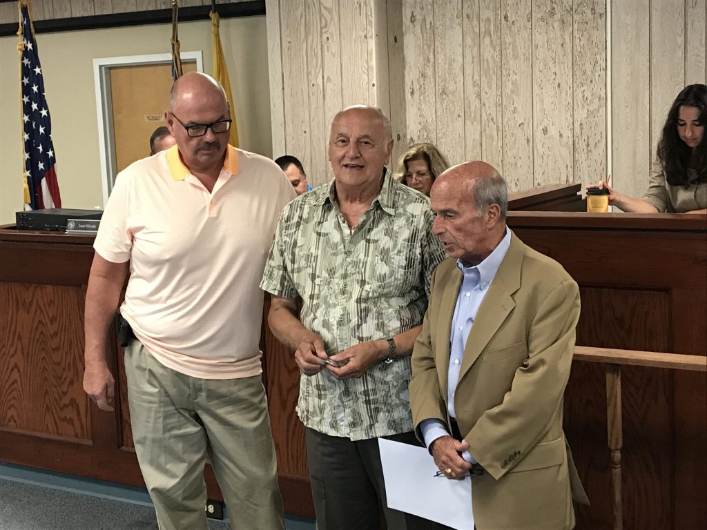 Councilmen Rich Tompkins and Guy Mazzanti receiving honors at the Seaside Heights municipal complex. (Photo: Daniel Nee)