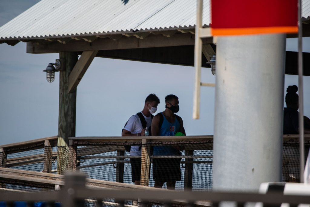 Visitors to the boardwalk and rides in Seaside Heights, N.J. wear face masks July 8, 2020. (Photo: Daniel Nee)