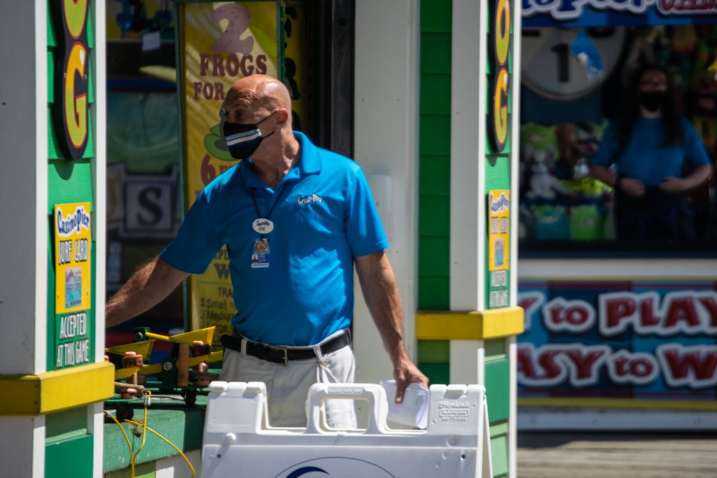 Visitors to the boardwalk and rides in Seaside Heights, N.J. wear face masks July 8, 2020. (Photo: Daniel Nee)