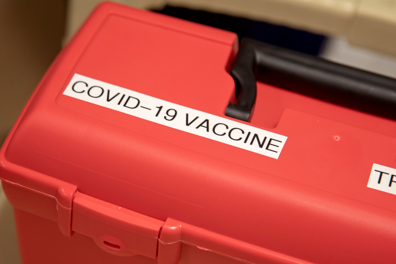 FedEx delivered the first tray of the Pfizer COVID-19 vaccine to Holy Name Medical Center in Teaneck, NJ. Nancy Palamara and Joseph Cruz accepted the vaccine and stored it in the 80 degree below zero freezer. (Credit: Jeff Rhode/Holy Name Medical Center)