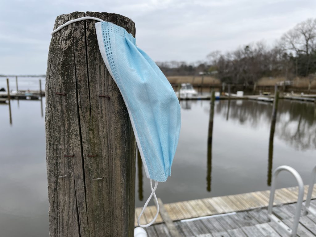 A face mask against a piling at a local marina. (Photo: Daniel Nee)