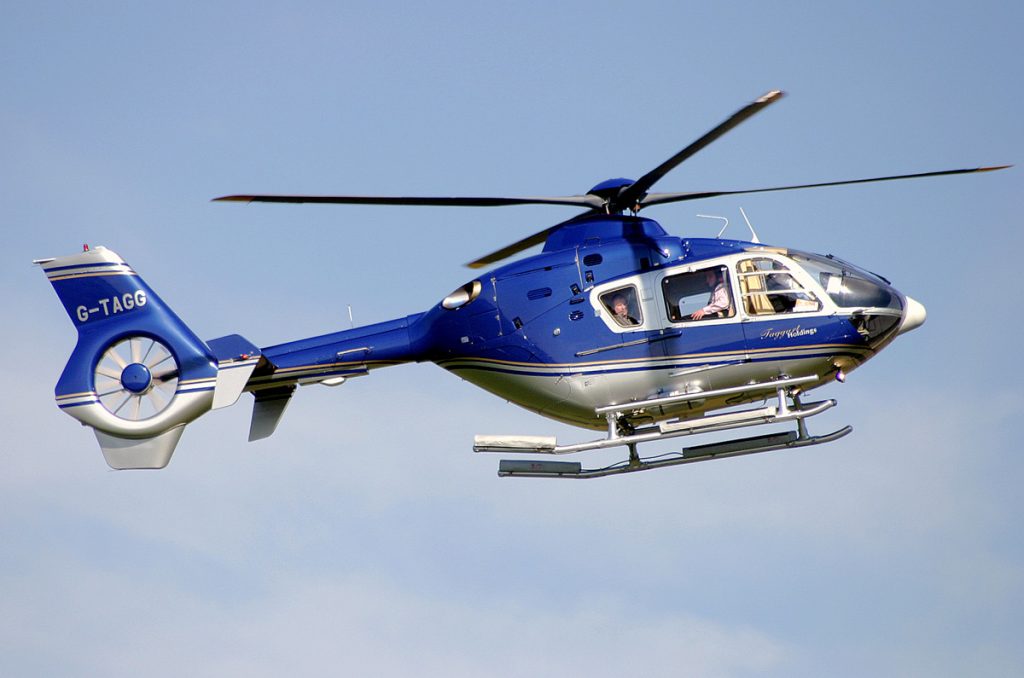 A helicopter hovers over a helipad. (Credit: Pete Webber/ Flickr)