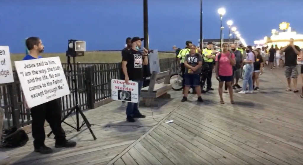 A group of religious activists demonstrate on the boardwalk in Seaside Heights, N.J. (Credit: Time to Change/YouTube)
