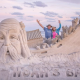John and Laura Gowdy show off one of their famous sand sculptures. (Photo: Laura Gowdy/Instagram)