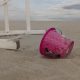 A beach sand pail next to a lifeguard chair in Seaside Heights, N.J., July 2022. (Photo: Daniel Nee)