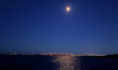 The moon rises over the Mantoloking Bridge, Brick Township, Aug. 2022. (Photo: Daniel Nee)