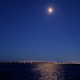 The moon rises over the Mantoloking Bridge, Brick Township, Aug. 2022. (Photo: Daniel Nee)