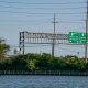 Highway signs entering the barrier island from the Route 37 bridge. (Photo: Daniel Nee)