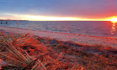 The sun provides a stunning flash before setting between clouds, Jan. 28, 2023. (Photo: Daniel Nee)