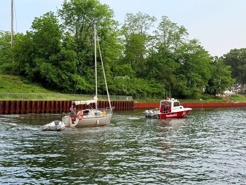 Crews rescue a sailboat wedged under the Route 88 bridge in Point Pleasant Borough, June 6, 2025. (Credit: Point Pleasant Borough Fire Department)
