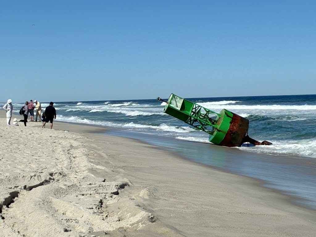A green "13" buoy marker washes up in Seaside Heights, N.J., April 2026. (Credit: Diane Il Grande)