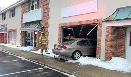 A car plows into a building in Toms River, Jan. 10, 2017. (Photo: TRPD)