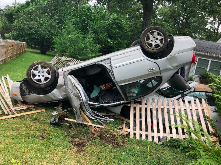 A vehicle landed on top of another after hitting a curb in Toms River. (Photo: TRPD)