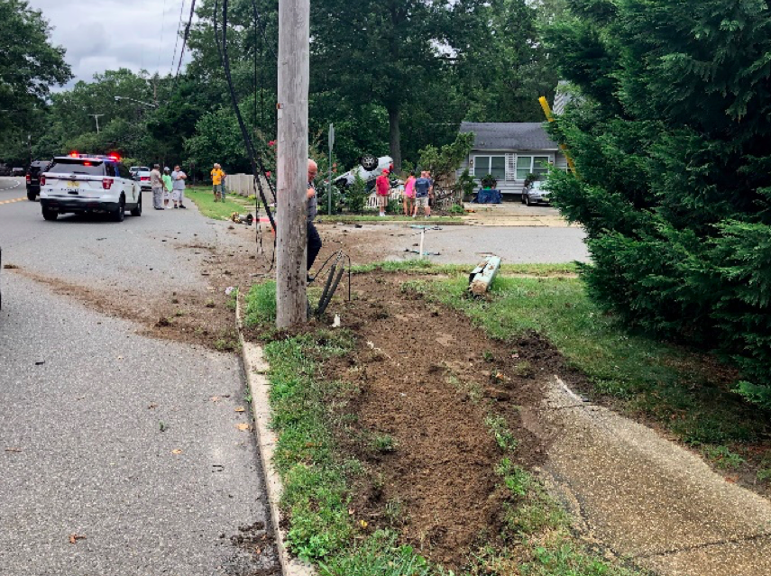 A vehicle landed on top of another after hitting a curb in Toms River. (Photo: TRPD)