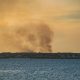 A controlled burn in Ocean County, N.J. produces a plume of smoke over Barnegat Bay, Feb. 28, 2022. (Photo: Daniel Nee)