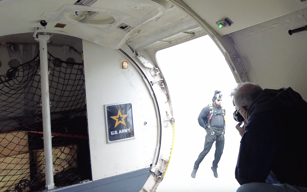 A jumper from the U.S. Army Golden Knights parachutes out of a Dash-8 at Joint Base McGuire-Dix-Lakehurst. (Photo: Shorebeat)