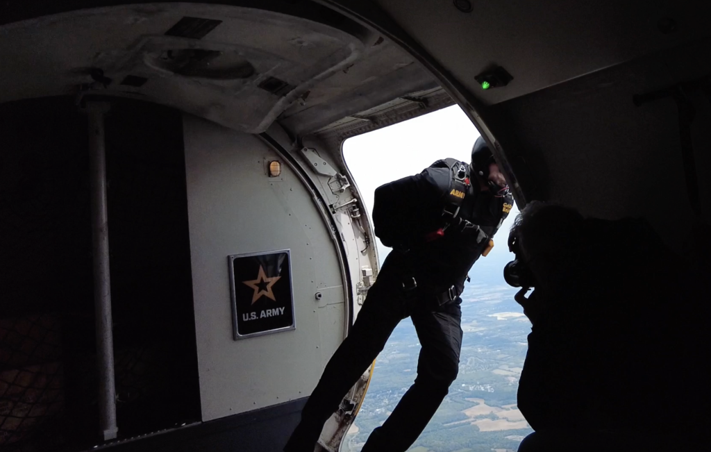 A jumper from the U.S. Army Golden Knights parachutes out of a Dash-8 at Joint Base McGuire-Dix-Lakehurst. (Photo: Shorebeat)