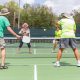 A group plays Pickleball at a purpose-built court. (Credit: Openverse/ Creative Commons)